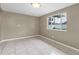 Spacious living room with tile flooring and large window for natural light at 1461 S Hillcrest Ave, Clearwater, FL 33756