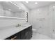 Bathroom with a large vanity, a sink, a toilet and gold hardware at 15012 Winterwind Dr, Tampa, FL 33624