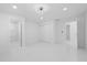 Large bedroom with modern ceiling fan, closet, ensuite bath, and views of the yard at 15012 Winterwind Dr, Tampa, FL 33624