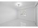 Bright bedroom with clean lines, fan, natural light, and modern flooring at 15012 Winterwind Dr, Tampa, FL 33624