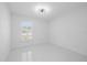 Bedroom with a large window, offering views of the yard at 15012 Winterwind Dr, Tampa, FL 33624