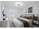 Bedroom with large window, comfortable bed, and tasteful decor at 15012 Winterwind Dr, Tampa, FL 33624