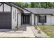 Inviting home exterior with a meticulously landscaped yard and a freshly painted facade at 15012 Winterwind Dr, Tampa, FL 33624