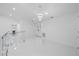 Hallway features marble floors, glass railings, and contemporary lighting fixtures at 15012 Winterwind Dr, Tampa, FL 33624