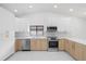 Contemporary kitchen with sleek appliances, ample counter space, and modern finishes at 15012 Winterwind Dr, Tampa, FL 33624