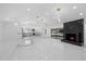 Bright open living space with recessed lighting and a modern fireplace feature at 15012 Winterwind Dr, Tampa, FL 33624