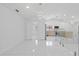 Bright open living space with recessed lighting and access to an additional room at 15012 Winterwind Dr, Tampa, FL 33624