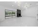 Bright open living space with recessed lighting, an access to the backyard, and a fireplace at 15012 Winterwind Dr, Tampa, FL 33624