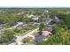 A scenic aerial view of the neighborhood, with lush trees, roads, and various homes at 15012 Winterwind Dr, Tampa, FL 33624
