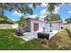 Enjoy a well-maintained backyard with patio area, perfect for outdoor gatherings at 1809 Chinaberry Dr, Oldsmar, FL 34677