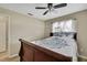Bright bedroom with a modern ceiling fan and natural light shining through the windows at 1809 Chinaberry Dr, Oldsmar, FL 34677