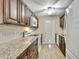 A bright kitchen featuring well-maintained appliances, cabinetry, and countertops at 1809 Chinaberry Dr, Oldsmar, FL 34677