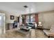 The neutral and stylish living area features wood-look tiling and light-filled windows at 1809 Chinaberry Dr, Oldsmar, FL 34677
