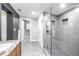 Luxurious bathroom with a glass-enclosed shower, stylish tile, and a granite vanity at 200 Lamara Ne Way, St Petersburg, FL 33704