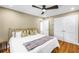 Inviting bedroom with hardwood floors, a ceiling fan, and double-door closet at 200 Lamara Ne Way, St Petersburg, FL 33704