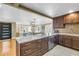 Stylish kitchen with a large island, stainless steel appliances, and open layout to dining area at 200 Lamara Ne Way, St Petersburg, FL 33704