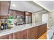 Well-equipped kitchen featuring stainless steel appliances, marble countertops, and custom cabinetry at 200 Lamara Ne Way, St Petersburg, FL 33704