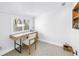Bright office with a modern desk, patterned floor, and natural light from the window at 200 Lamara Ne Way, St Petersburg, FL 33704
