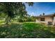 Fenced-in backyard offers space and privacy, perfect for outdoor activities and landscaping at 2003 Whispering Pines St, Largo, FL 33774