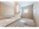 Bathroom featuring granite counters, a vanity, toilet, tub and shower at 2003 Whispering Pines St, Largo, FL 33774