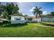 Charming single-story home featuring a front lawn and a one car garage at 2003 Whispering Pines St, Largo, FL 33774