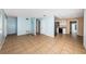 Open concept living space with tile flooring connecting the kitchen and living areas at 2003 Whispering Pines St, Largo, FL 33774