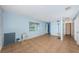 Open living area with tile flooring and fresh paint throughout the home at 2003 Whispering Pines St, Largo, FL 33774