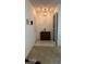 Entryway with carpeted seating area, tiled floor, coat closet, and wooden cabinet at 205 Strong Bow Ct, Sun City Center, FL 33573