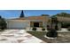 A single Gathering home featuring a patterned driveway, manicured lawn, and a two-car garage at 205 Strong Bow Ct, Sun City Center, FL 33573