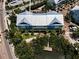 An aerial view showcases the townhouse with the boat dock to enjoy on the canal at 208 Haven Beach Ct, Indian Rocks Beach, FL 33785