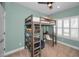 bedroom featuring loft bed with built-in desk and shelving, promoting organization and maximizing space at 208 Haven Beach Ct, Indian Rocks Beach, FL 33785