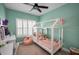 bedroom featuring a unique play house bed, a pink beanbag chair, and a bright window at 208 Haven Beach Ct, Indian Rocks Beach, FL 33785