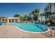 Relax by the sparkling community pool with ample lounge seating, perfect for soaking up the Florida sun at 208 Haven Beach Ct, Indian Rocks Beach, FL 33785