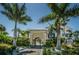 Welcome to The Cove at Indian Rocks Beach, featuring a gated entrance surrounded by tropical landscaping at 208 Haven Beach Ct, Indian Rocks Beach, FL 33785