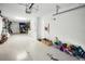 Spacious two-car garage with ample storage, featuring clean, painted walls and doors leading to the interior at 208 Haven Beach Ct, Indian Rocks Beach, FL 33785