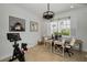Well-lit home office with two desks, a comfortable chair, and bright windows at 208 Haven Beach Ct, Indian Rocks Beach, FL 33785