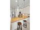 Bright kitchen featuring granite countertops, white cabinetry, and stainless steel appliances at 208 Haven Beach Ct, Indian Rocks Beach, FL 33785