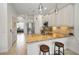 Bright kitchen with a breakfast bar, stainless steel appliances, and an adjacent office space at 208 Haven Beach Ct, Indian Rocks Beach, FL 33785
