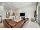 Spacious living room featuring an open floor plan, tile floors and a modern kitchen at 208 Haven Beach Ct, Indian Rocks Beach, FL 33785