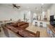 Open-concept living room with view of the kitchen featuring stainless steel appliances and bar seating at 208 Haven Beach Ct, Indian Rocks Beach, FL 33785