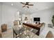 Open living space showcases the dining area, kitchen with bar seating, and living room at 208 Haven Beach Ct, Indian Rocks Beach, FL 33785