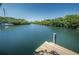 Scenic view of the waterfront from the wooden dock area, perfect for enjoying the natural beauty of the community at 208 Haven Beach Ct, Indian Rocks Beach, FL 33785