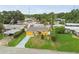 Aerial view of a well-kept home with green lawn, nice landscaping, and a long driveway at 2818 Lorraine St, Tampa, FL 33614