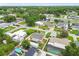This is a neighborhood aerial view of a yellow home with mature trees at 2818 Lorraine St, Tampa, FL 33614