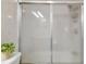 Bathroom's shower with translucent sliding doors and white tile at 2818 Lorraine St, Tampa, FL 33614