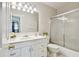 Bathroom with a single sink vanity and shower with glass doors at 2818 Lorraine St, Tampa, FL 33614
