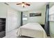 Bedroom with tile floors, ceiling fan, and closet for storage at 2818 Lorraine St, Tampa, FL 33614