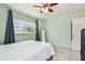 Light-filled bedroom with tile floors and a standing mirror at 2818 Lorraine St, Tampa, FL 33614
