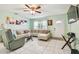 Comfortable living room featuring tile floors, neutral walls and a large window at 2818 Lorraine St, Tampa, FL 33614