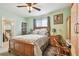 Main bedroom featuring a wooden bed frame and walk-in closet at 2818 Lorraine St, Tampa, FL 33614